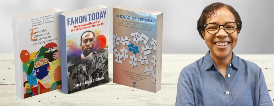 Photo of associate research scholar Rosemere da Silva with her publications, Ensino da literatura no contexto contemporaneo, fanon Today, and O chao da escola.